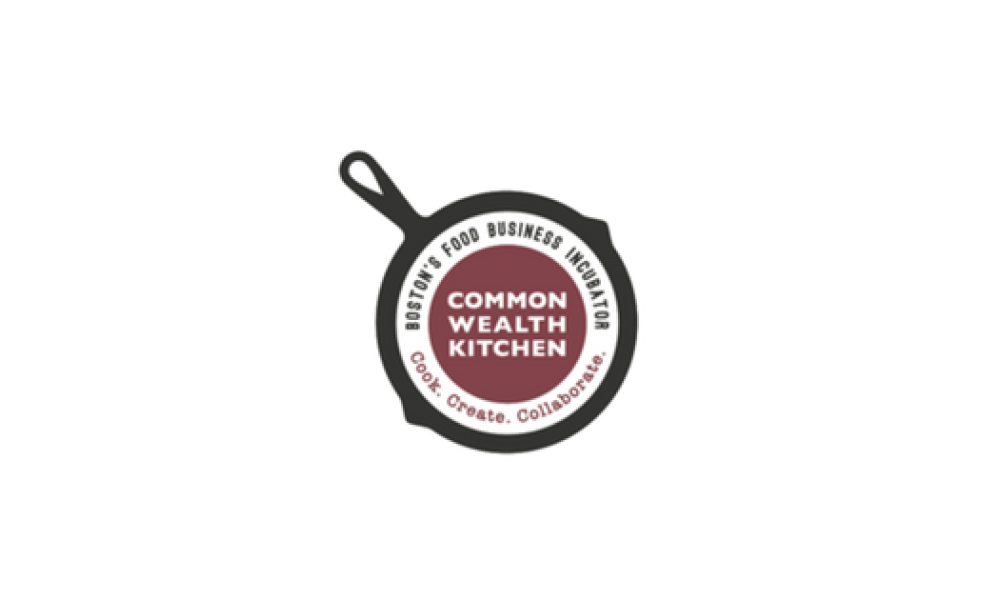 commonwealth kitchen logo with white font in front of burgundy background inside of a skillet